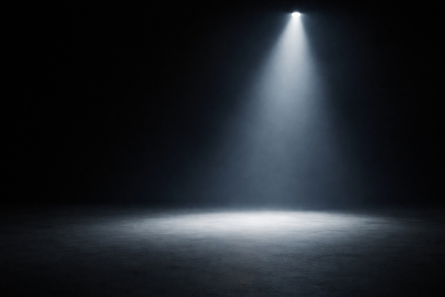 Minimal spotlight in darkness representing clarity before execution in strategy and growth